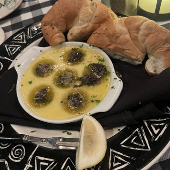 Manhattan Restaurant - Escargot in garlic butter sauce with warmed croissant. - Steakhouses Near Me - Fresno, California Manhattan Restaurant - Escargot in garlic butter sauce with warmed croissant. - Steakhouses Near Me - Fresno, California