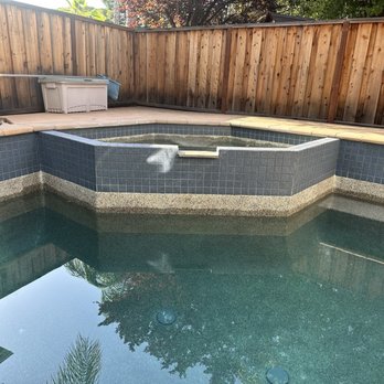 Nate's Pool Tile Cleaning - After cleaning (white looking area is sun glare, not calcium) - Pool Cleaners Near Me