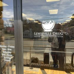 Lewisville Drug Company - Front entrance and hours, March 2025.
