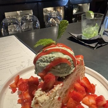 Ronin Sushi - Basque Cheesecake with matcha whipped cream, powdered sugar, lemon zest, and strawberries -- GF! (April special) - Japanese Near Me - Royal Oak, Michigan
