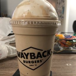 a cold drink in a plastic cup