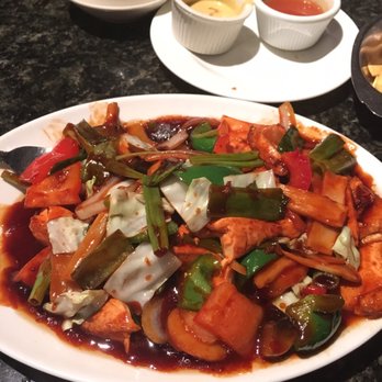 Peking Chester - Large chunks of Home style tofu and veggies! Spot the sauces and fried noodles in the background. - Chinese Near Me - Chester, Virginia Peking Chester - Large chunks of Home style tofu and veggies! Spot the sauces and fried noodles in the background. - Chinese Near Me - Chester, Virginia