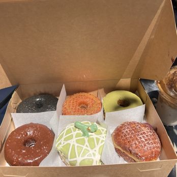 Bun Appetit - Left to right, top to bottom: black sesame, churro, matcha hazelnut, chocolate hazelnuts, melona, blueberry cream filled - Donuts Near Me - Fremont, California Bun Appetit - Left to right, top to bottom: black sesame, churro, matcha hazelnut, chocolate hazelnuts, melona, blueberry cream filled - Donuts Near Me - Fremont, California