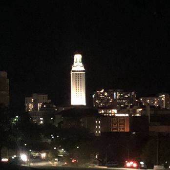 Broadway in Austin - Seeing a crescent moon on right of tower apparently resting on a building - Performing Arts Near Me - Austin, Texas
