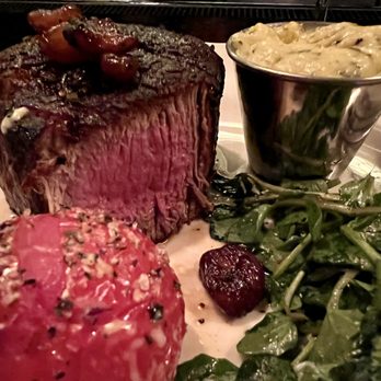 Monkey Bar - Filet mignon, comes with béarnaise sauce, greens, and roasted tomato. We also ordered some roasted garlic which was a great addition! - American Near Me - New York, New York Monkey Bar - Filet mignon, comes with béarnaise sauce, greens, and roasted tomato. We also ordered some roasted garlic which was a great addition! - American Near Me - New York, New York
