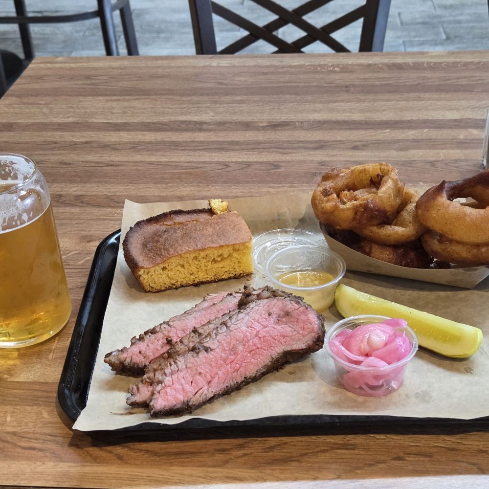 One meat combo, tri tip (corn bread, onion rings, pickle, coleslaw)