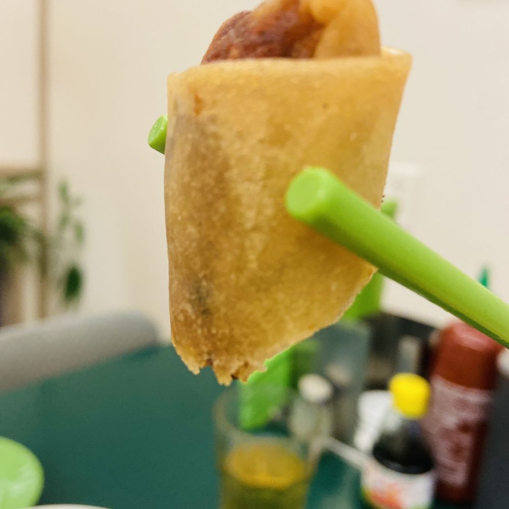 Pho Nhuan - a piece of food being held by a pair of chopsticks - Vietnamese Near Me - Vancouver, British Columbia Pho Nhuan - a piece of food being held by a pair of chopsticks - Vietnamese Near Me - Vancouver, British Columbia