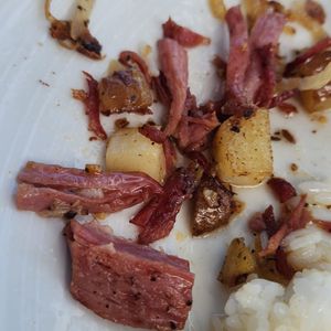 Photo of Bogart's Cafe - Honolulu, HI, United States. Seriously, it's like corned beef pot roast with carmelized onion and tender chunks of potato ....  2 scoops rice and eggs.  Perfection!!!