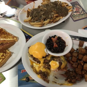 The Templeton - Side of French toast (which needed more salt and sweetness), pulled pork Benny with black beans, and vegan poutine (highly recommend!) - Breakfast & Brunch Near Me - Vancouver, British Columbia