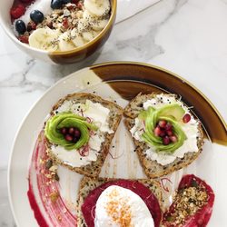 Contrast - Açaí bowl in the back and avocado toasts