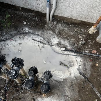 SolarMax Technology - paint spilled and left by technician after "repair". water irrigation valve access under all that paint. - Solar Installation Near Me - Riverside, California