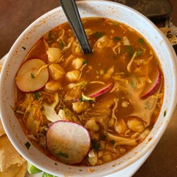 a bowl of soup with tortillas a bowl of soup with tortillas
