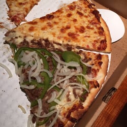 Alecsie's House of Pizza - Too much toppings causing a already thin cost to be raw in a few spots.