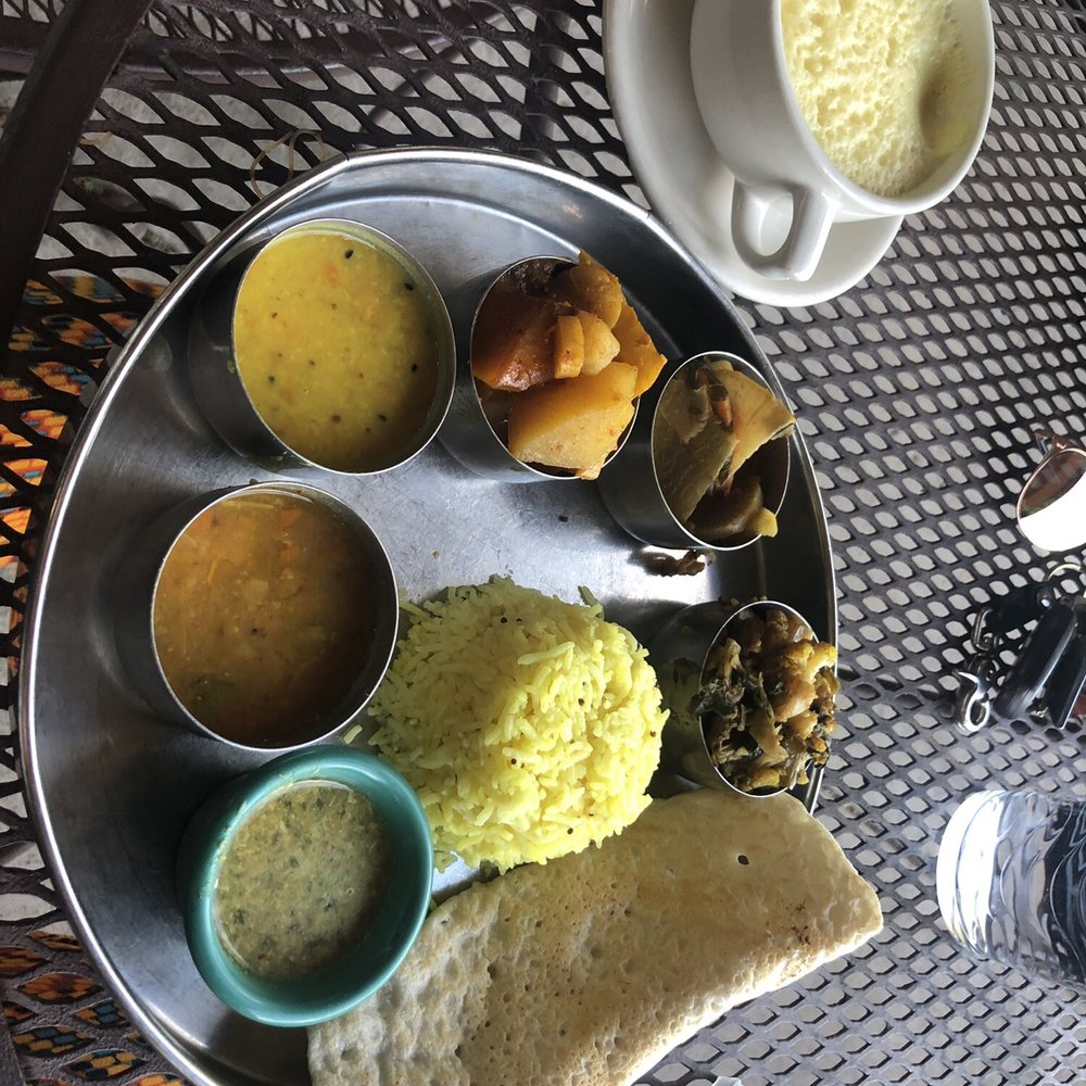 Annapurna's - Thaali plate with basmati rice & a dosa, golden milk on the left. - Vegetarian Near Me - Santa Fe, New Mexico Annapurna's - Thaali plate with basmati rice & a dosa, golden milk on the left. - Vegetarian Near Me - Santa Fe, New Mexico