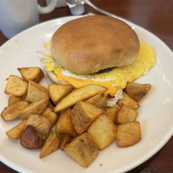 Emeril’s Table - Sausage egg sandwich- good but tiny tiny sausage patty - Seafood Near Me - Kenner, Louisiana