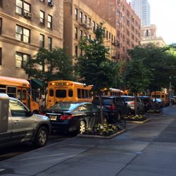 P S M169 - Robert F Kennedy - East 88th Street. Glad I don't live at this corner. They are backed up every day idling. 06/27/17