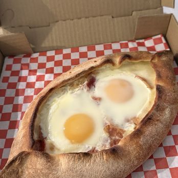 Egg Boat - A golden bread boat with two eggs tucked into the center. If you love bread and a savory breakfast, how could you resist? - Georgian Near Me - San Fernando Valley, California Egg Boat - A golden bread boat with two eggs tucked into the center. If you love bread and a savory breakfast, how could you resist? - Georgian Near Me - San Fernando Valley, California