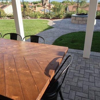 Solid Rock Landscape - A closer look at the stamped concrete (with a two tone release) and pathway to fire pit. - Landscaping Near Me
