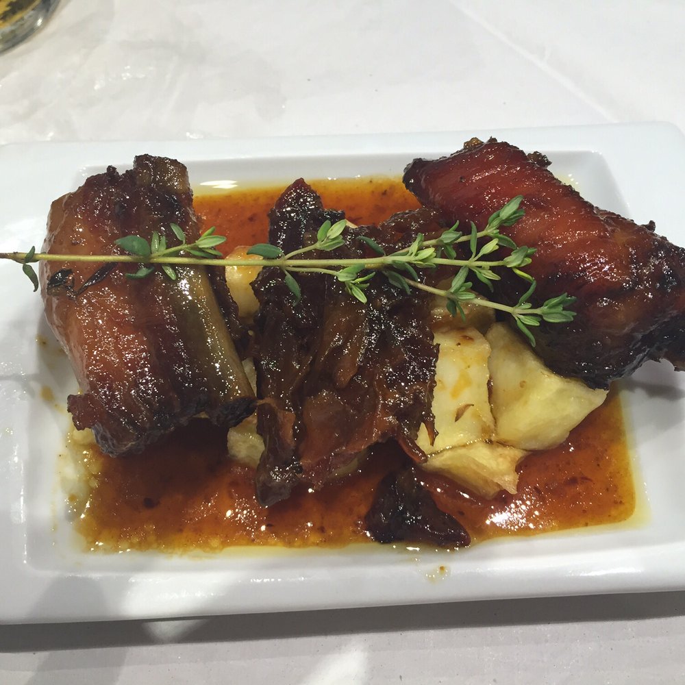 Eslava - Costilla de cerdo con miel de romero al horno. - Tapas Bars Near Me - Seville, SE Eslava - Costilla de cerdo con miel de romero al horno. - Tapas Bars Near Me - Seville, SE