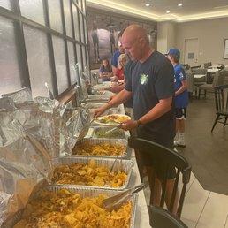 Our hotel was gracious enough to let us use their breakfast area to set up the many trays of food buffet-style.