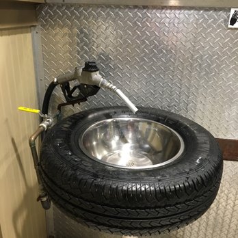 Ford's Garage - That's right; even their bathrooms are decked out with car them. You get to wash her hands in the spare tire. - Burgers Near Me - Brandon, Florida Ford's Garage - That's right; even their bathrooms are decked out with car them. You get to wash her hands in the spare tire. - Burgers Near Me - Brandon, Florida
