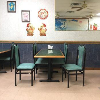 Hong Kong - a table and chairs in a restaurant - Chinese Near Me - South Boston, Virginia Hong Kong - a table and chairs in a restaurant - Chinese Near Me - South Boston, Virginia
