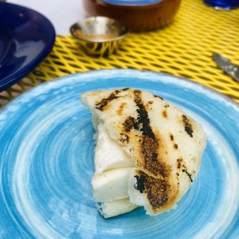 Peka Restaurant - Half eaten cheese arepa - Latin American Near Me - Brighton, Massachusetts Peka Restaurant - Half eaten cheese arepa - Latin American Near Me - Brighton, Massachusetts