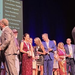 Palm View Dental Alhambra - Dr. Ho on stage to receive an award for her experience and excellence in providing Invisalign clear aligner treatment.