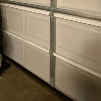 Consolidated Garage Doors - Inside angle, garage door, photo shot of,  silver color horizontal stabilization bar installed. - Garage Door Services Near Me - Batavia, Illinois