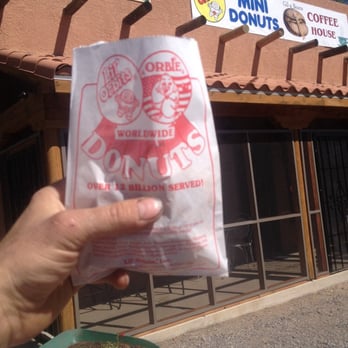 Gil-a Beans Coffee Shop with Lil' Orbits Mini-Donuts - ws a hand holding a bag - Coffee & Tea Near Me - Silver City, New Mexico Gil-a Beans Coffee Shop with Lil' Orbits Mini-Donuts - ws a hand holding a bag - Coffee & Tea Near Me - Silver City, New Mexico