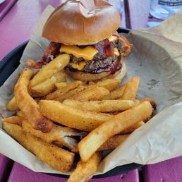 Barbeque bacon cheese burger and fries. Barbeque bacon cheese burger and fries.