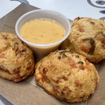 Royal Street Veranda - Baked Cheesy Biscuits with Cajun Cheese Sauce - New American Near Me - Anaheim, California Royal Street Veranda - Baked Cheesy Biscuits with Cajun Cheese Sauce - New American Near Me - Anaheim, California