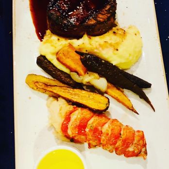 Narcoossee's - Butter-poached Cold Water Lobster Tail And Grilled Filet Mignon - New American Near Me - Lake Buena Vista, Florida Narcoossee's - Butter-poached Cold Water Lobster Tail And Grilled Filet Mignon - New American Near Me - Lake Buena Vista, Florida