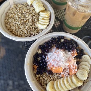 Kula Shave Ice - Basic bowl: left, honey, banana, granola  Hilo bowl: right , blueberries, honey, granola, coconut shreds and papaya Two Vietnamese coffees - Shaved Ice Near Me - Hilo, Hawaii