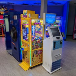 Playland Arcade - You get your card and load points on it to swipe at any machine or game.