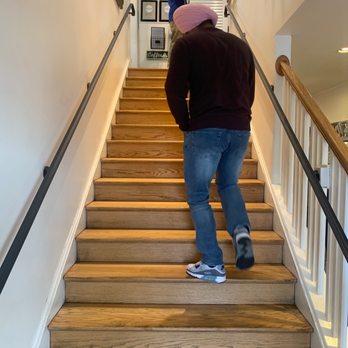 Del Ray Cafe - a man walking up a flight of stairs - French Near Me - Alexandria, Virginia Del Ray Cafe - a man walking up a flight of stairs - French Near Me - Alexandria, Virginia