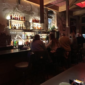 Kate Martin - people sitting at a bar - Cocktail Bars Near Me - Lincoln, Nebraska