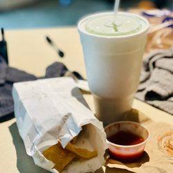 Two Empanadas - Two Empanadas filled with Nutella with strawberry dipping sauce! Mango Pineapple slush!