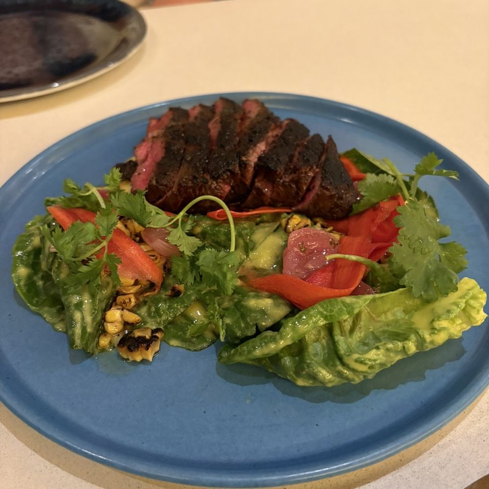 kann - KANN COFFEE RUBBED NEW YORK STRIP wet-aged american wagyu, ti malice, fermented hot sauce, kann coffee bbq sauce, herb relish - Caribbean Near Me - Portland, Oregon
