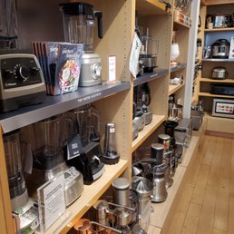 a shelf full of kitchen appliances