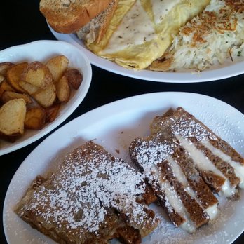 Flip Cafe - Pumpkin roll french toast with home fries and bacon and  cheese omelet with flip potatoes w and 2 HUGE slices of homemade rye toast. - Breakfast & Brunch Near Me - Edinboro, Pennsylvania