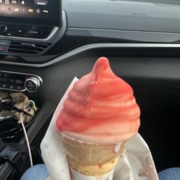 A sad cherry dipped ice cream cone. A sad cherry dipped ice cream cone.