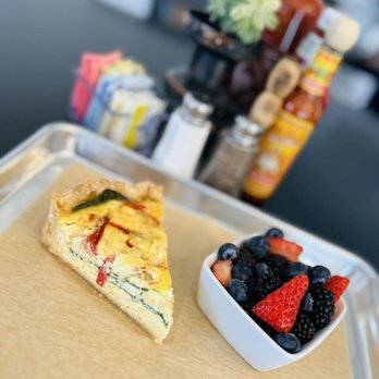 Rowdy Rooster - Quiche with Roasted Red Peppers, Feta Cheese, Spinach and Caramelized Onions with a Side of Fruit - Breakfast & Brunch Near Me - Marthasville, Missouri Rowdy Rooster - Quiche with Roasted Red Peppers, Feta Cheese, Spinach and Caramelized Onions with a Side of Fruit - Breakfast & Brunch Near Me - Marthasville, Missouri