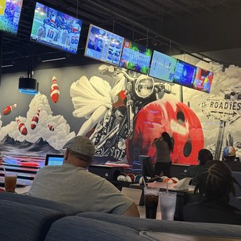 Roadies - The bowling area is bright and vibrant with murals - Gastropubs Near Me - Tucson, Arizona