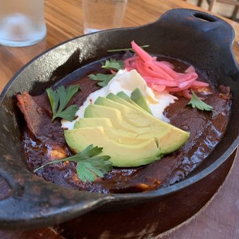 Chaak Kitchen - Enchilada en Cazuela - gruyere, swiss, red chile sauce, avocado, crema for $15 - Cocktail Bars Near Me - Tustin, California Chaak Kitchen - Enchilada en Cazuela - gruyere, swiss, red chile sauce, avocado, crema for $15 - Cocktail Bars Near Me - Tustin, California