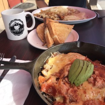The Coffee Cup Cafe - Huevos Rancheros & Salmon Avocado Skillet with sourdough toast and coffee. - Coffee & Tea Near Me - Monument, Colorado