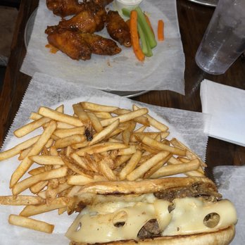 Germantown Pub - Philly cheesesteak and fries 12 piece wings (tossed in Buffalo + lemon pepper and garlic Parmesan ) - Pubs Near Me - Nashville, Tennessee Germantown Pub - Philly cheesesteak and fries 12 piece wings (tossed in Buffalo + lemon pepper and garlic Parmesan ) - Pubs Near Me - Nashville, Tennessee