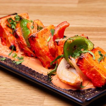 Jaxspice - Thick cuts of paneer, charred just right and kissed with a deep tandoori marinade, served over a creamy spiced sauce with roasted peppers - Indian Near Me - Jacksonville Beach, Florida Jaxspice - Thick cuts of paneer, charred just right and kissed with a deep tandoori marinade, served over a creamy spiced sauce with roasted peppers - Indian Near Me - Jacksonville Beach, Florida