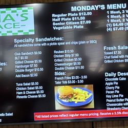Gina's Place - Menu board located behind cash registers