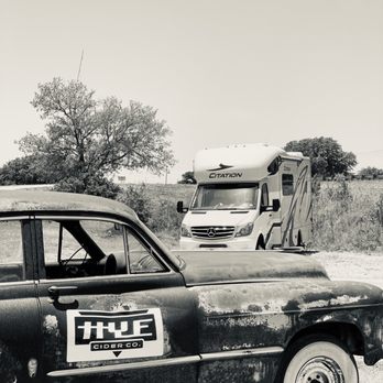 Hye Cider - a black and white photo of a truck and a bus - Cideries Near Me - Johnson City, Texas